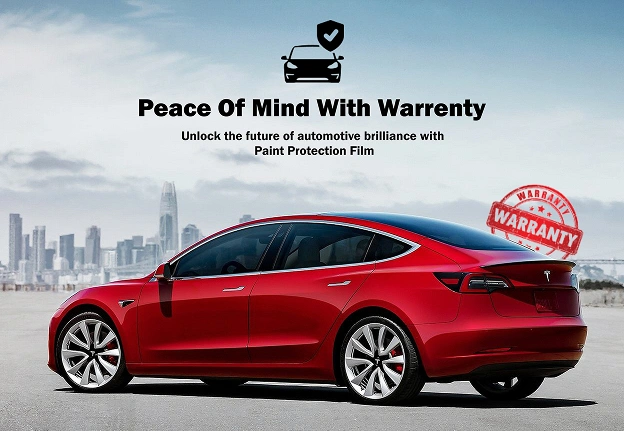 A red Tesla car with a view of a city skyline in the background, featuring a warranty stamp for paint protection.